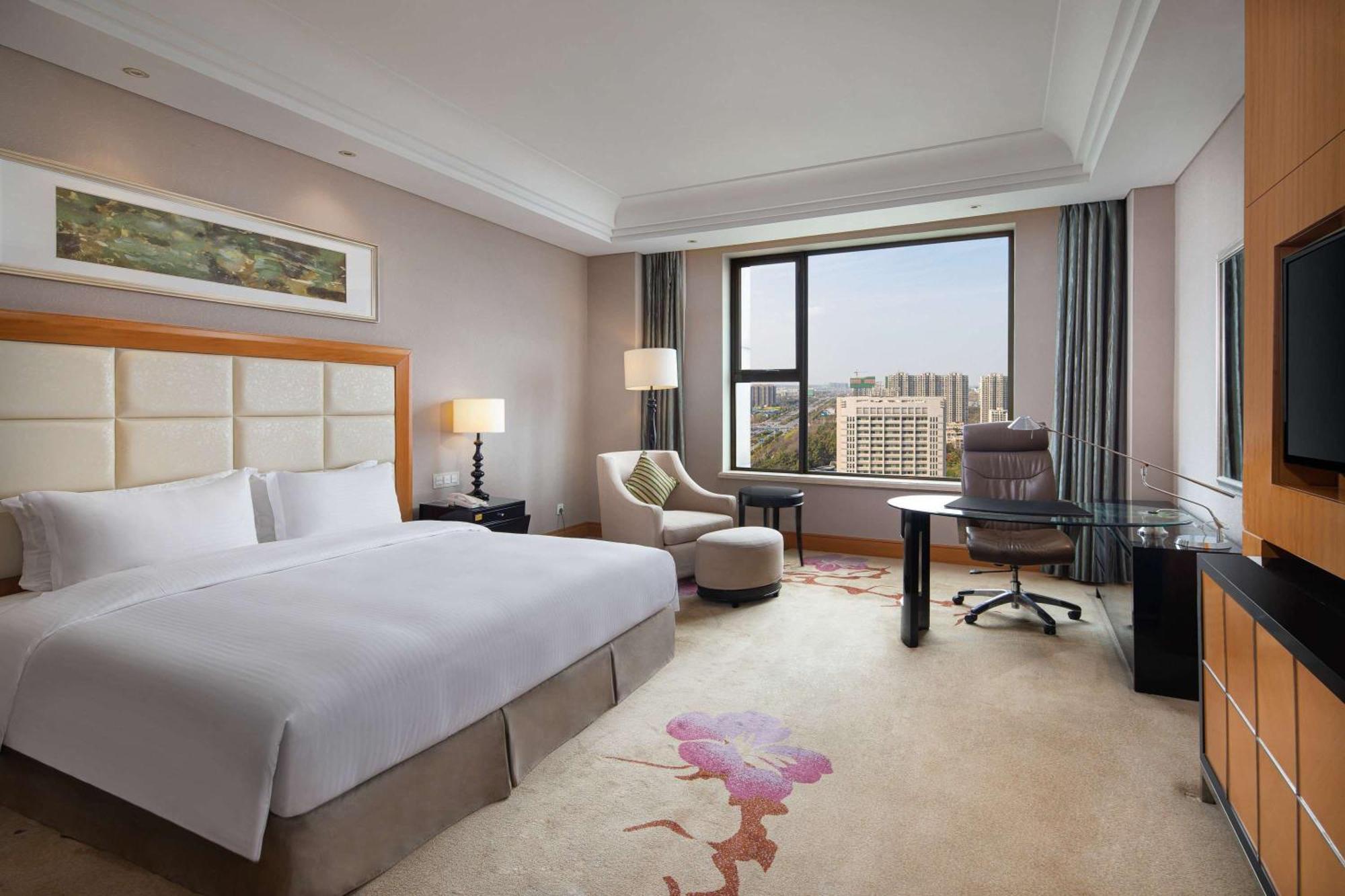 מלון Wyndham Xinyang Downtown מראה חיצוני תמונה